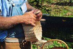 Man weaving a basket