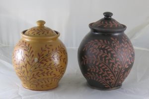 Photo of two pottery jars decorated with vines by Steinhagen